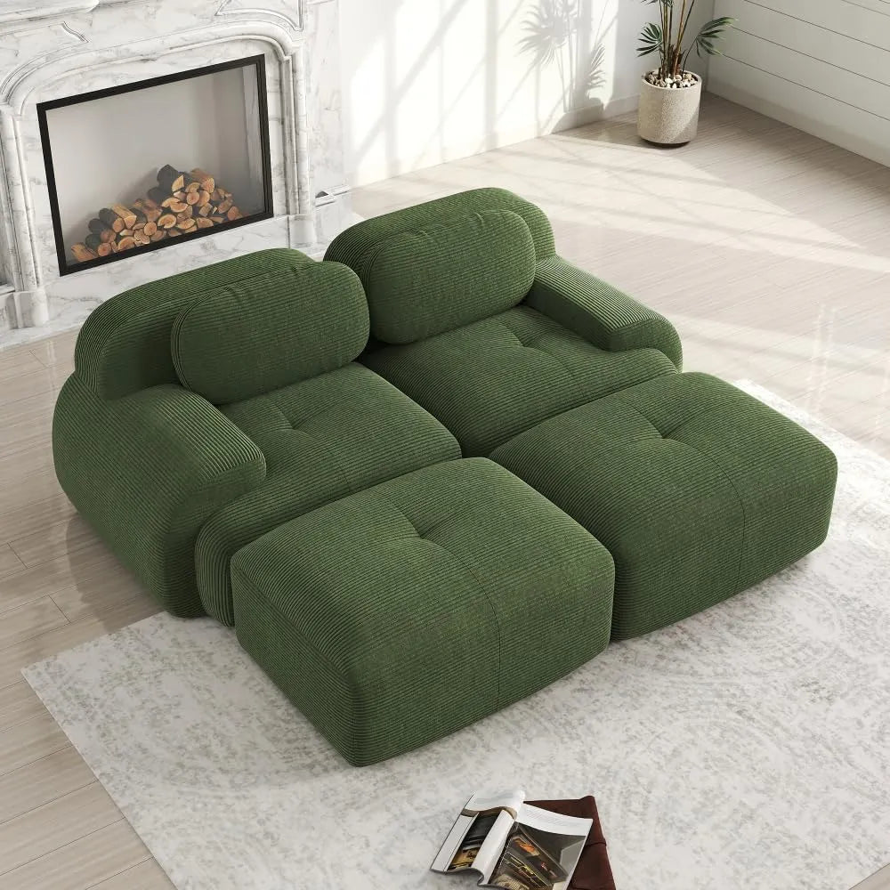 Canapé d'angle modulable en velours côtelé vert avec accoudoirs et repose-pieds